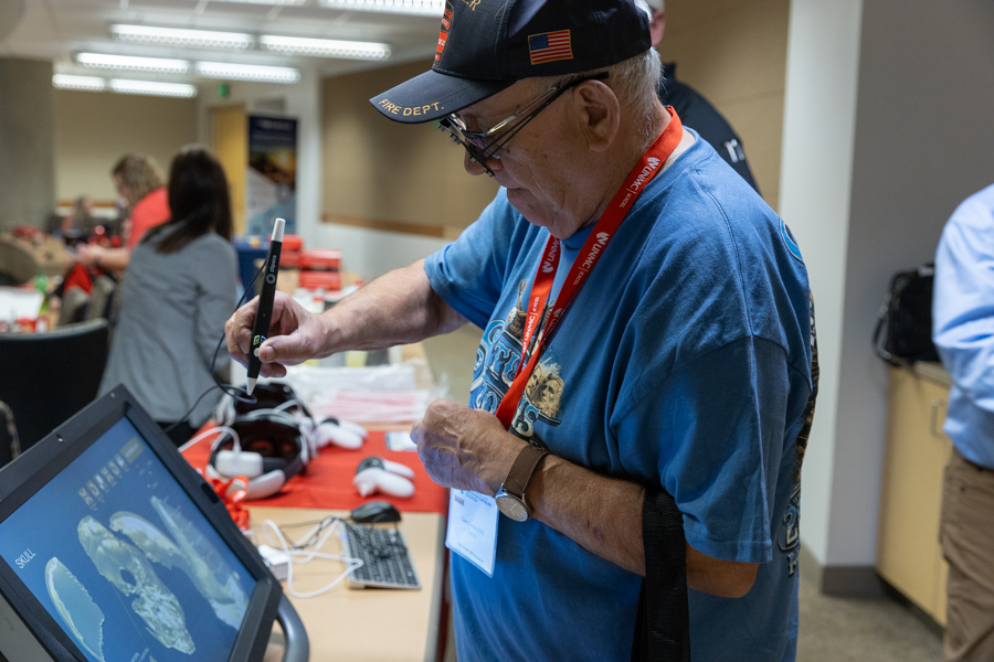 An attendee at the Activate EMS Symposium uses a desktop VR tool.