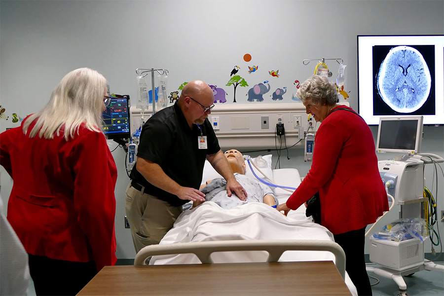 visitors looking at manikin