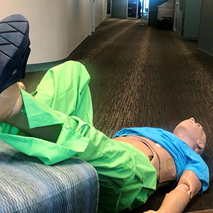 Simulation manikin on floor