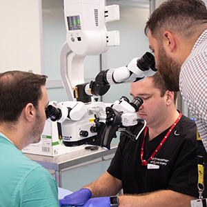 surgeons using microscope