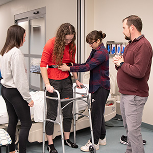 students practicing bed transfer techniques