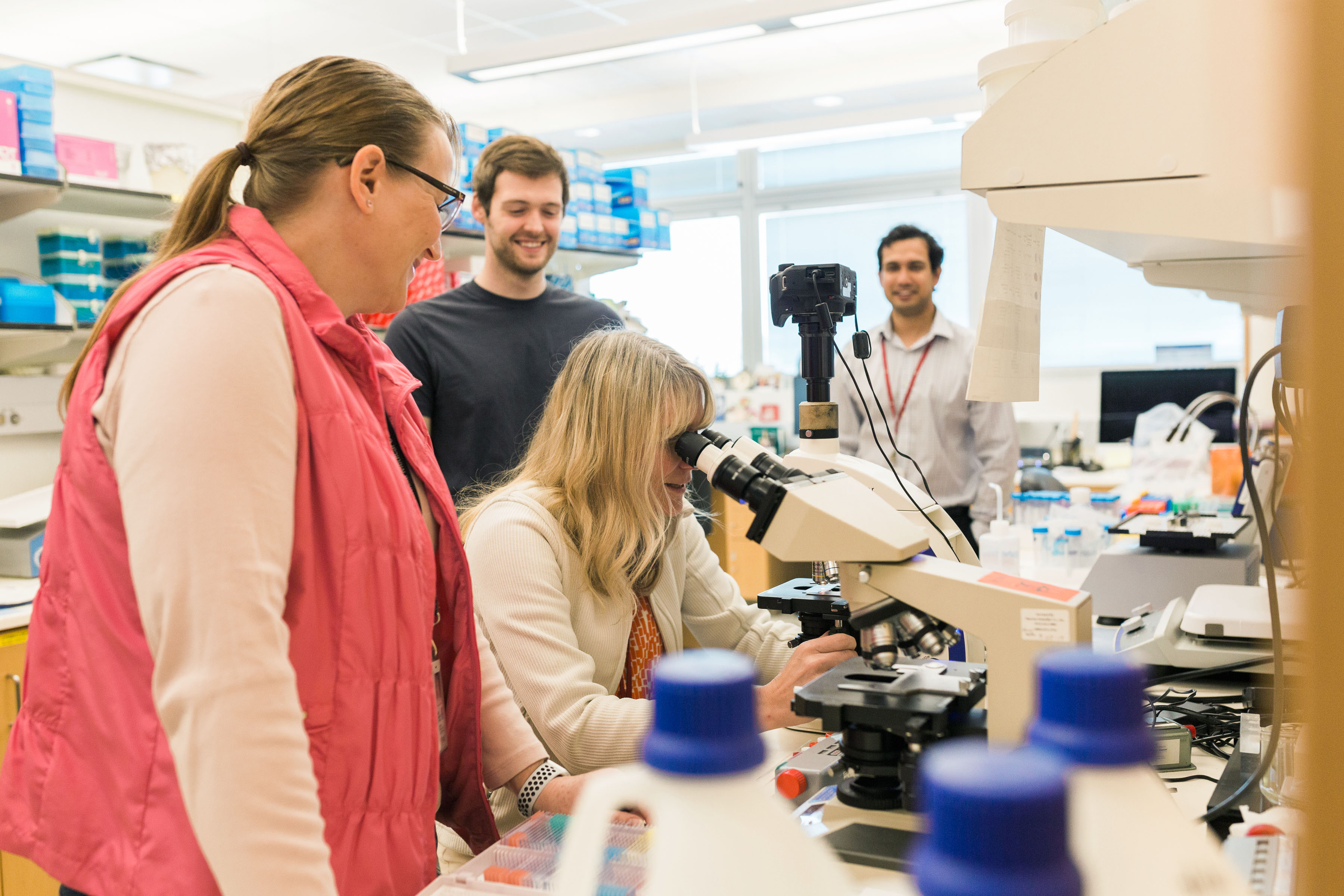 Dr. Jill Poole works in her UNMC research lab with her staff and trainees.
