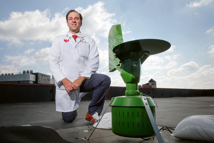 Andrew Rorie, M.D., with a Burkhard air sampler.
