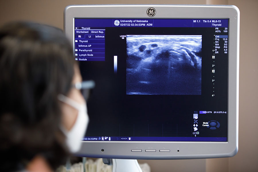 Trainee looks at an ultrasound screen.