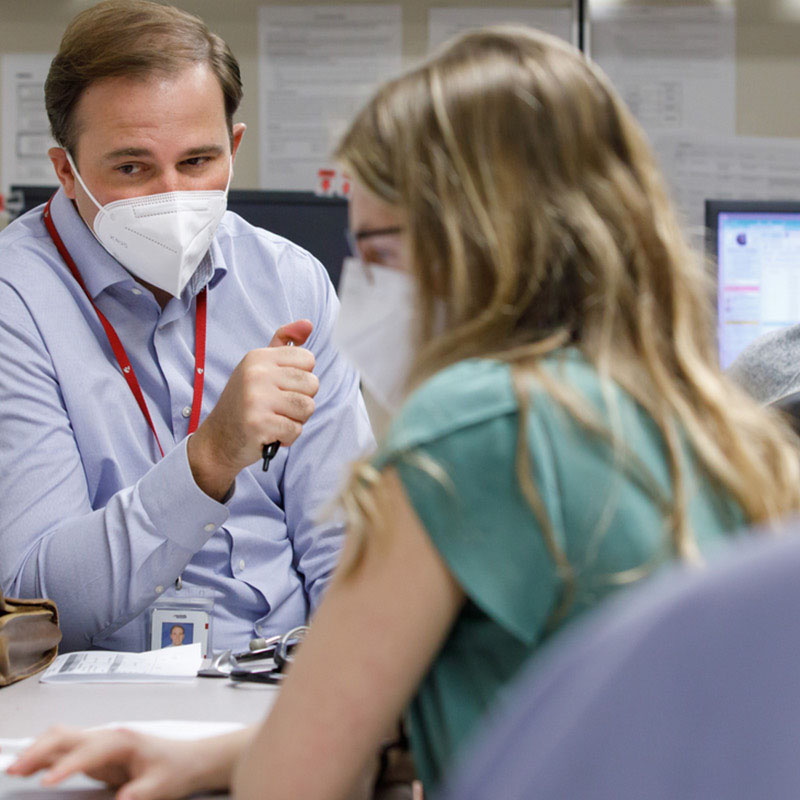 Faculty member works with a fellow