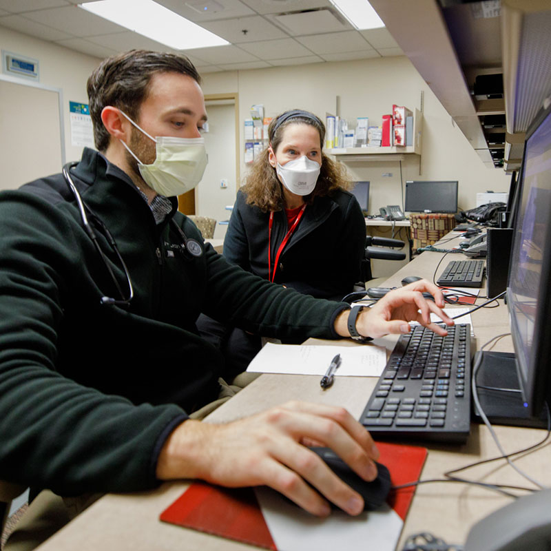 Rheumatology chief works with a fellow