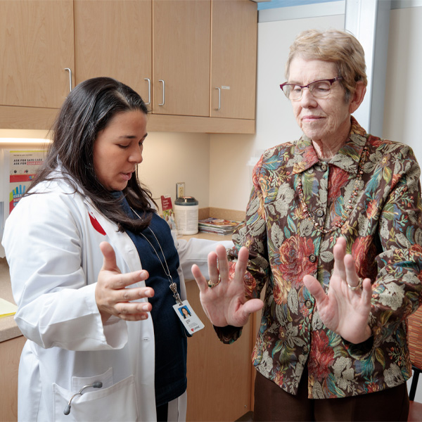 A doctor works on mobility with a patient