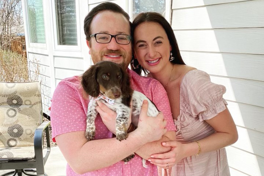 Dr. Joe Dougherty with his wife and puppy.