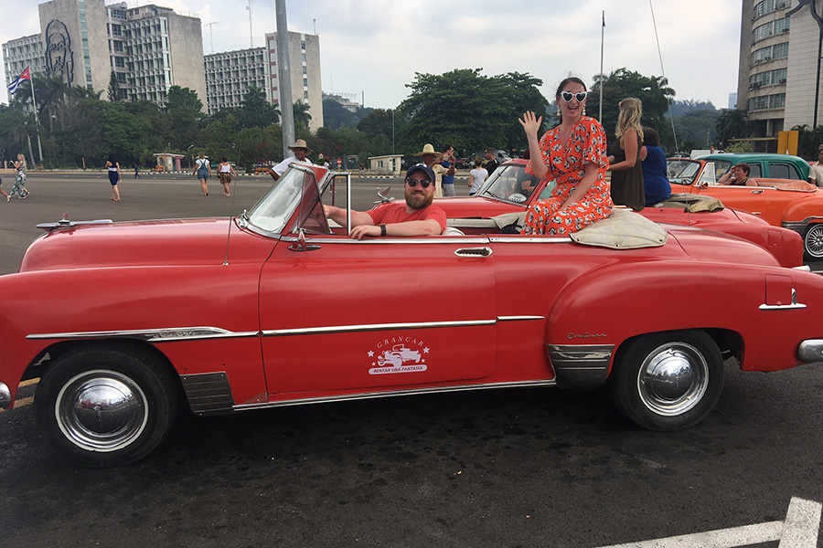 Dr. Joe Dougherty and his wife in a vintage car.