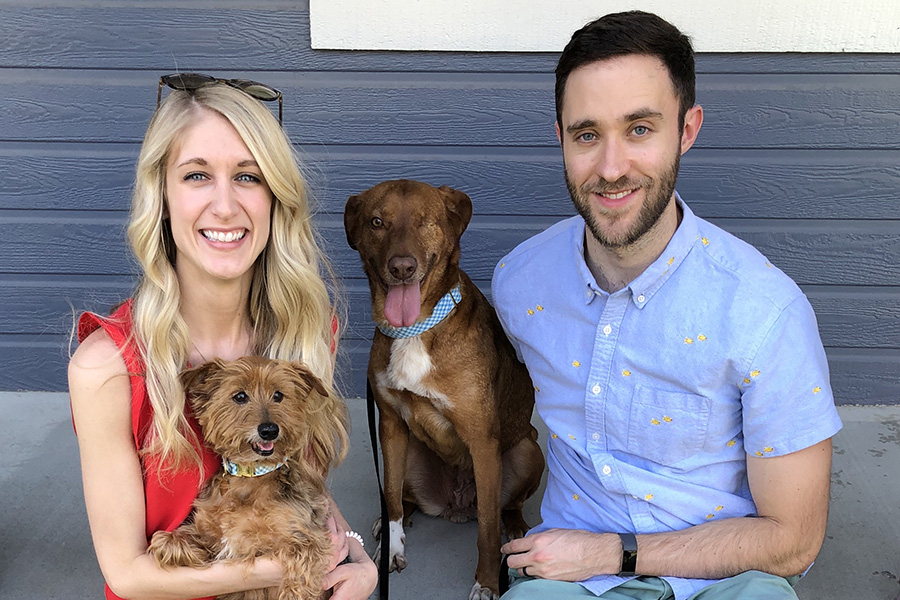 Dr. Jen Luedders with her husband and two dogs.