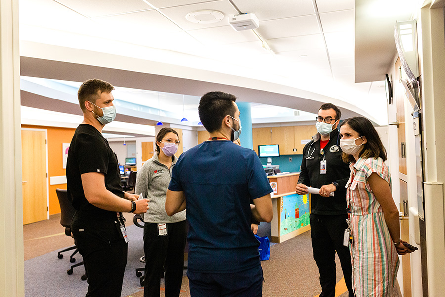 Med-Peds residents working with a UNMC faculty member.