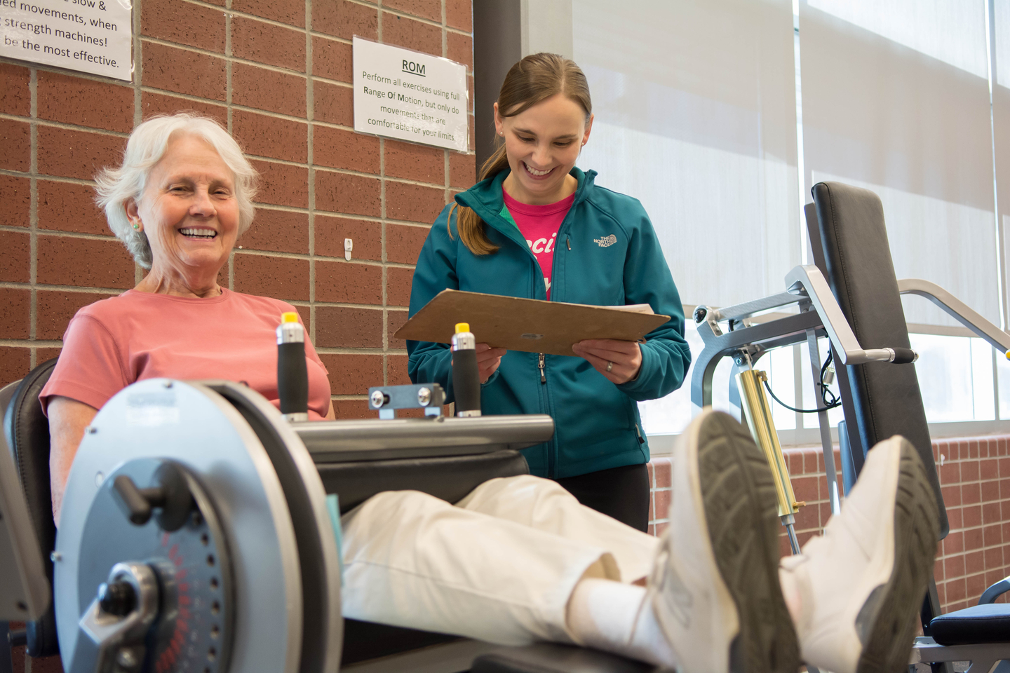 A trainer working with an Engage Wellness participant.