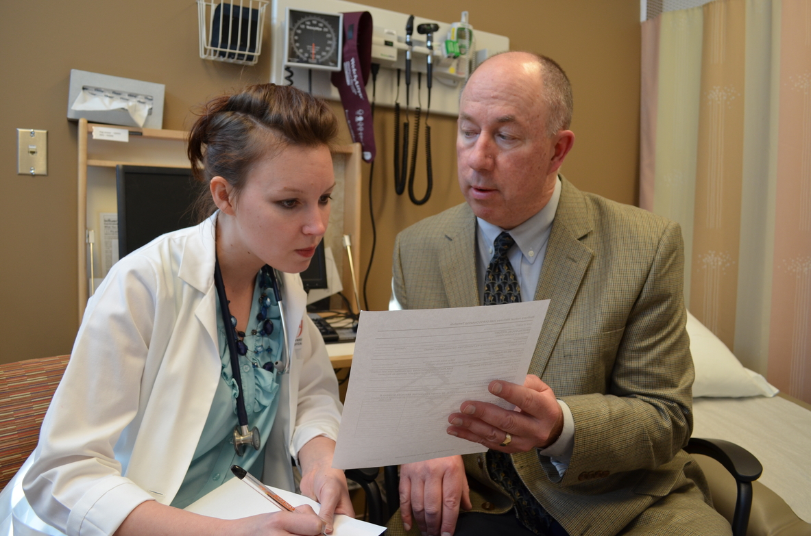 Faculty member discusses results with a trainee.