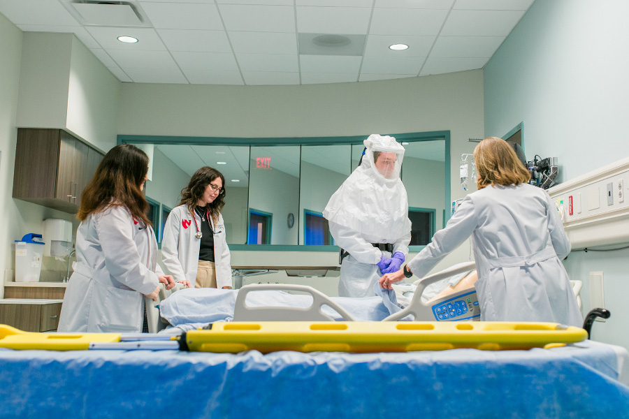 Infectious Diseases fellows practicing biocontainment measures in the Davis Global Center for Health Security.