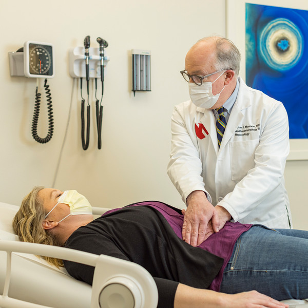 A doctor examines a patient