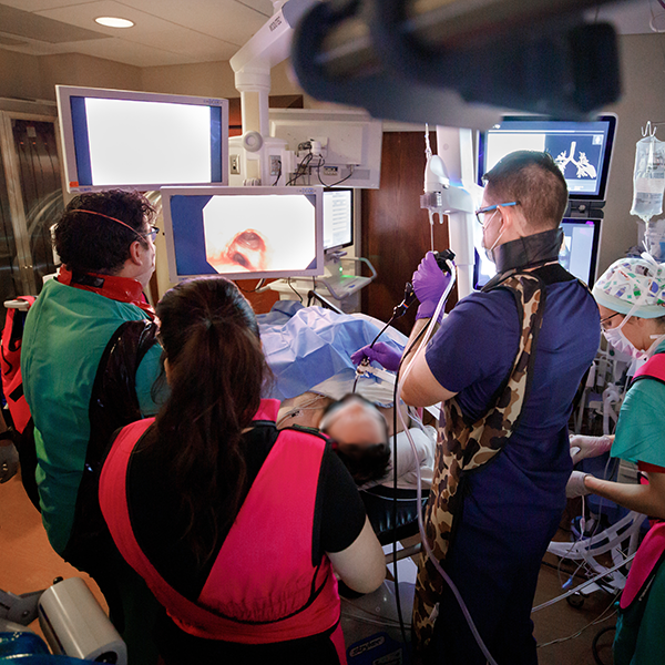 Staff and physician completing bronchial scope