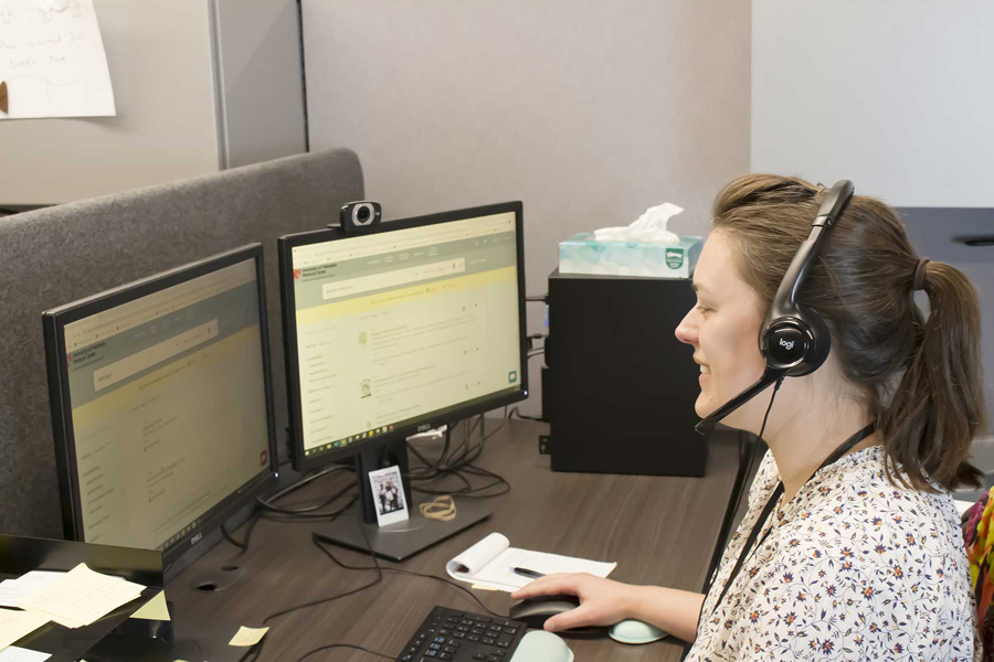 Person on phone at computer