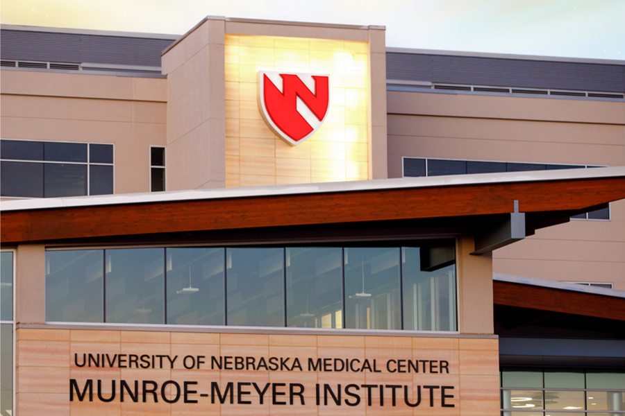 The front of the MMI building with a glowing light behind it.
