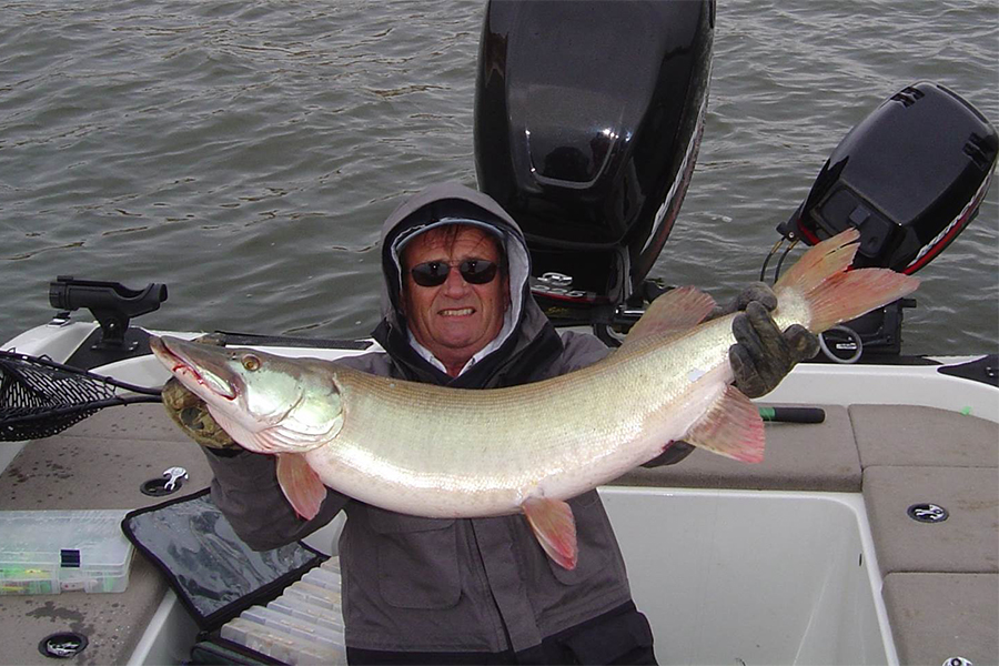 Sanger shows off a rather large fish that he caught.