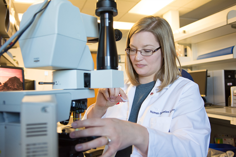 A woman works in a lab.