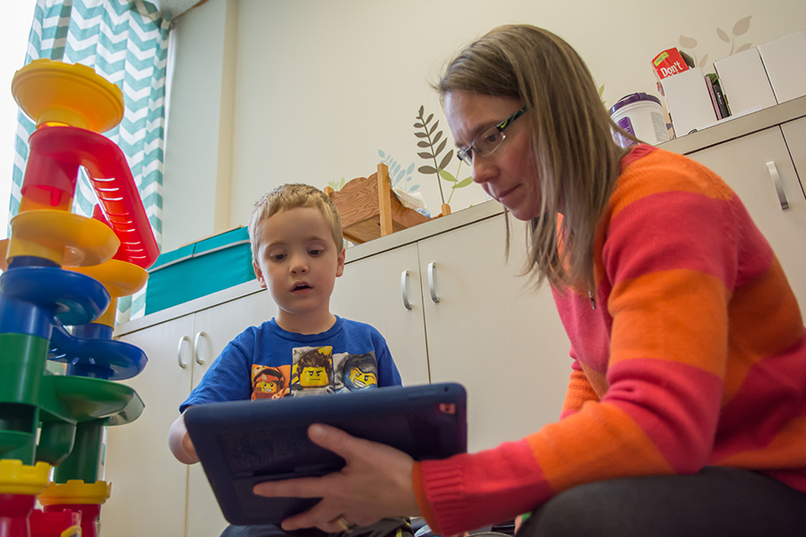 A MMI staff member works with a client