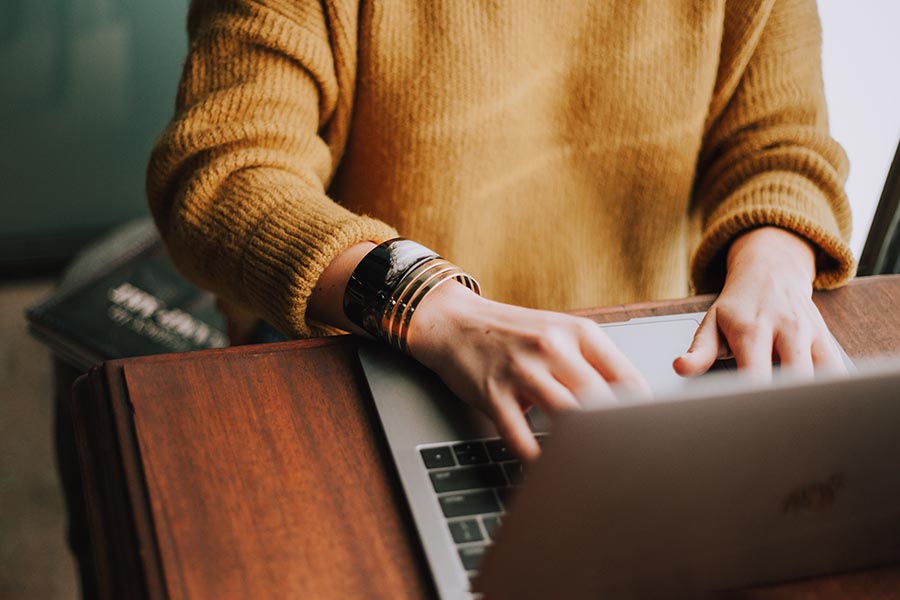 Adult using laptop, by Christin Hhume, from Unsplash.