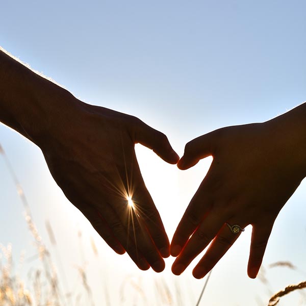 Two hands forming the shape of a heart