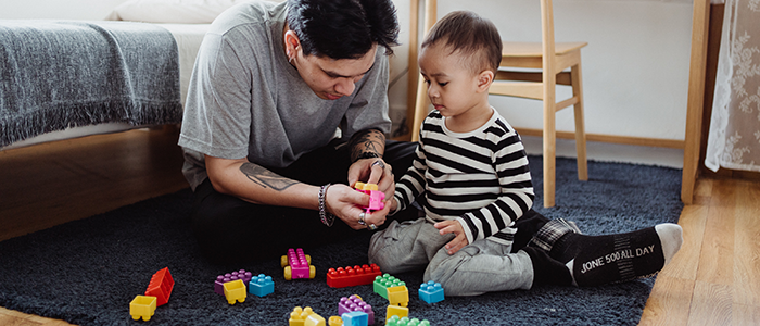 Father playing blocks with boy; Credit Ketut Subiyanto from Pexels