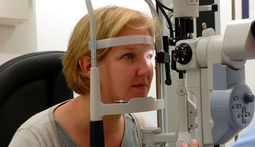 A patient receiving an eye exam.