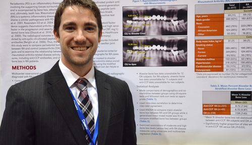 Paul Johnson in front of his award-winning poster presentation at the American Dental Association Annual Session in New Orleans earlier this month.