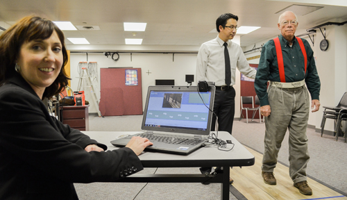 Dawn Venema, Ph.D.,  (left) and Joseph Siu, Ph.D., work with a research subject as part of their study.