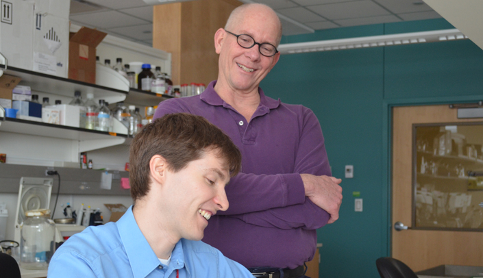 Tony Hollingsworth, Ph.D., works with a student.