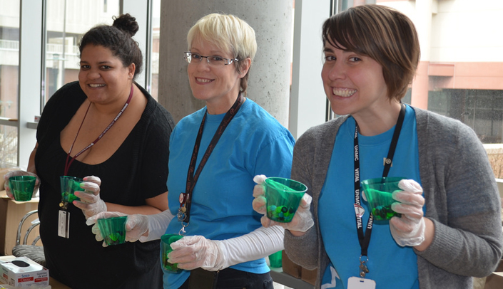 Volunteers serve candy, popcorn and root beer floats at Spirit Day on the UNMC Omaha campus.