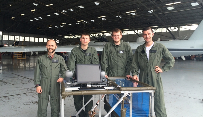 From left to right: UNL engineering students, Walter Bircher, Kearney Lackas, Thomas Frederick and UNMC surgical fellow, Anton Simorov, M.D.