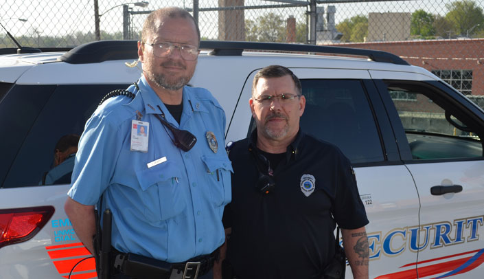 Campus security officer Gary Crowell displays the old uniform, and Sgt. Jeff Ebel wears the new uniform.