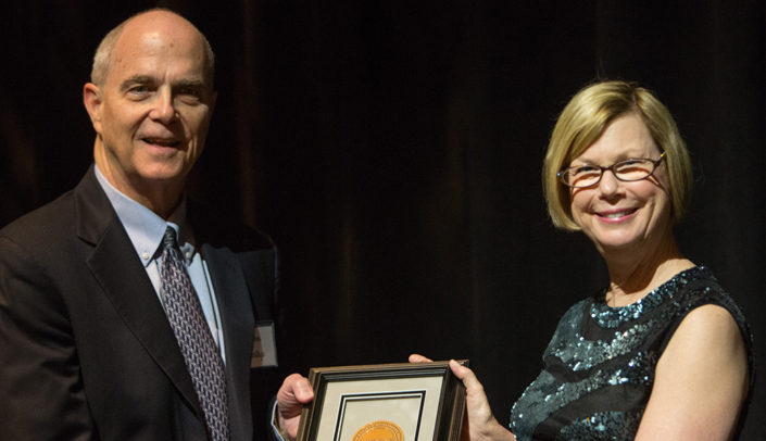 Sandra Swain, M.D., past president of the American Society of Clinical Oncology (ASCO), at right, presents James Armitage, M.D., with the Special Achievement Award. (Photo courtesy of ASCO.)