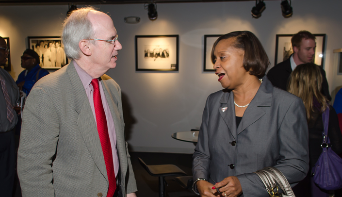UNMC Chancellor Jeffrey P. Gold, M.D., chats with Freddie Gray at a recent community event. Gray was named chairperson of UNMC's Board of Counselor's on Monday.