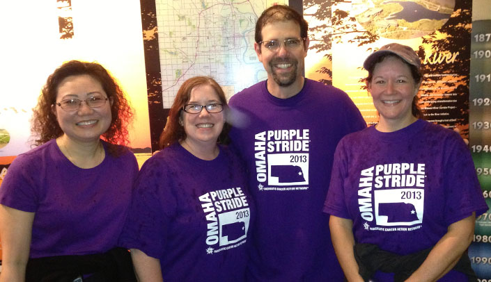 Members of the Tumornators, a UNMC/clinical enterprise-affiliated team taking part in the Purple Stride event. From left: Quan Ly, M.D., Melissa Campbell, Aaron Sasson, M.D., and Rachel Burg.