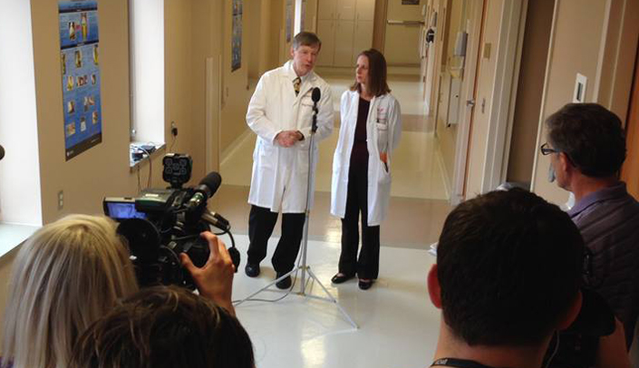 Philip Smith, M.D., and Angela Hewlett, M.D. speak with members of the press about the Biocontainment Unit.