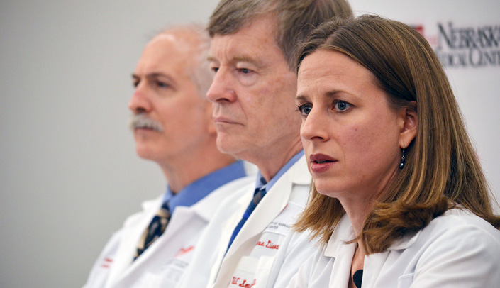 From left, physicians Mark Rupp, M.D., Phil Smith, M.D., and Angela Hewlett, M.D., at a recent press conference.