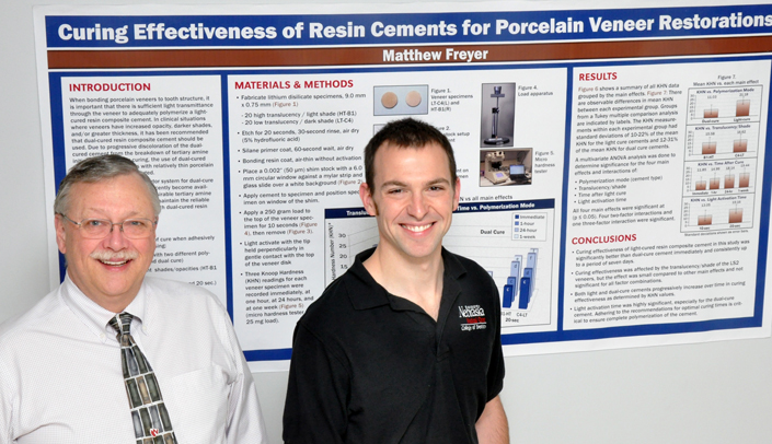 Matt Freyer, right, with mentor Henry St. Germain, D.M.D., displays his award-winning poster project.