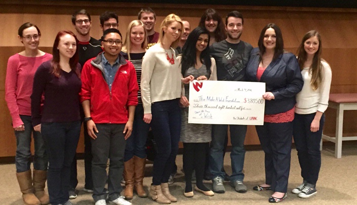College of Medicine first-year students present a check to the Make-a-Wish Foundation.