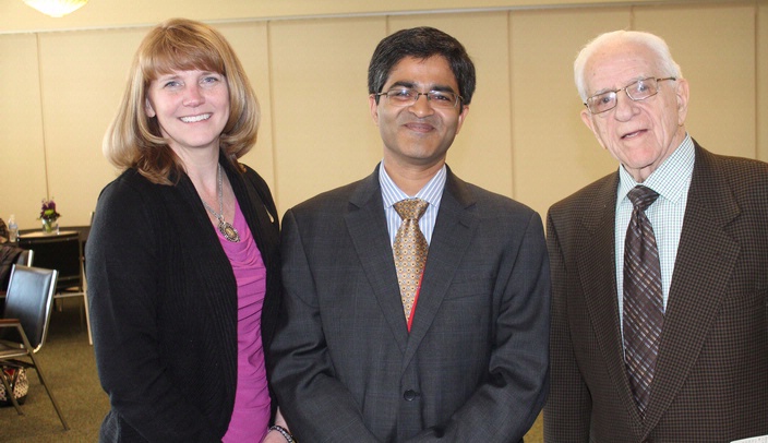 Sachin Kedar, M.B.B.S. (center), of the University of Nebraska Medical Center, received a $30,000 check from the Fremont Area Alzheimer’s Committee on Thursday. He was joined by Kathy Kirby (left) and Marv Welstead (right), both members of the Fremont Area Alzheimer’s Committee.