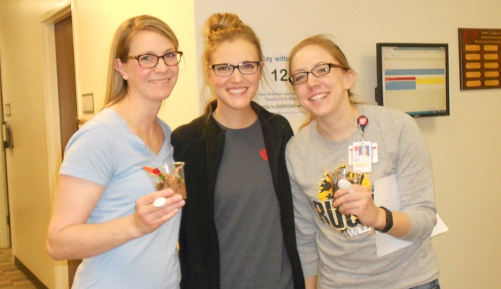Students at the College of Nursing-Lincoln Division enjoy "dirt-cup treats" Monday as part of the campus observation of Spirit Day