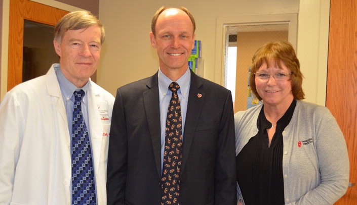From left, Phil Smith, M.D., professor of internal medicine, division of infectious diseases, and medical director of the Biocontainment Unit, Jordan Tappero, M.D., and Kate Boulter, lead nurse for the Biocontainment Unit.