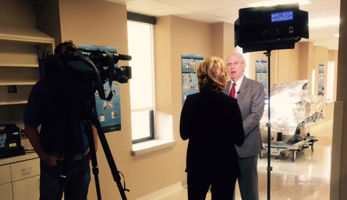 Kristi Krueger, anchor, WPLG TV-Miami, and Dan Palma, videographer, interview UNMC Chancellor Jeffrey P. Gold, M.D.