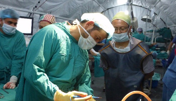 UNMC orthopaedic surgeon Miguel Daccarett, M.D., shown here working at the Nepal Orthopaedic Hospital, has been promoted to associate professor.