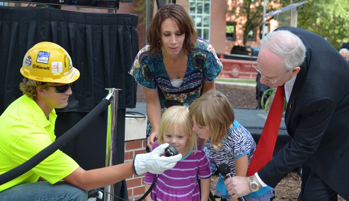 August's beam-raising ceremony was a memorable moment for the Fred & Pamela Buffett Cancer Center in 2015.