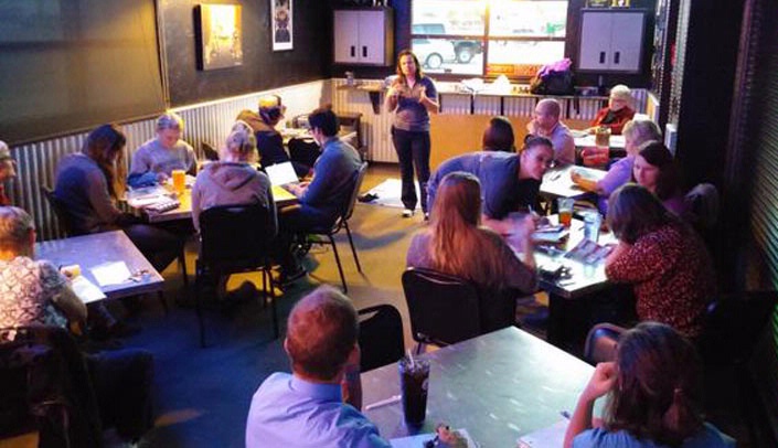 Beth Beam, Ph.D., speaks to a crowd at the Steel Grill in Gering on Oct. 14 as she and instructional technologist Stephen Smith presented "Educating the World on Ebola Care" at the Scottsbluff Cafe. The two College of Nursing staff members spoke to a large crowd at the event.