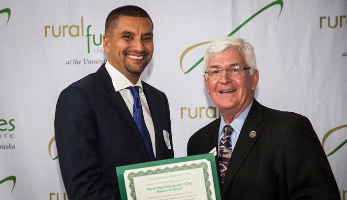 Patrik Johansson, M.D., received certificates from Chuck Schroeder, founding executive director, Rural Futures Institute, in honor of the completion of three grants.